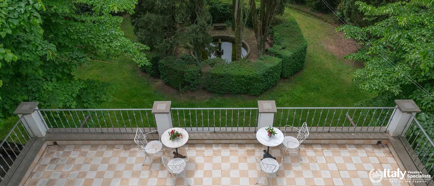 An inviting terrace overlooking a manicured garden.