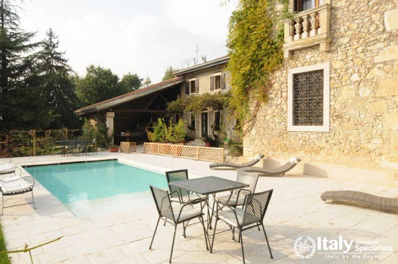 Sitting area near swimming pool in Villa Delizioso