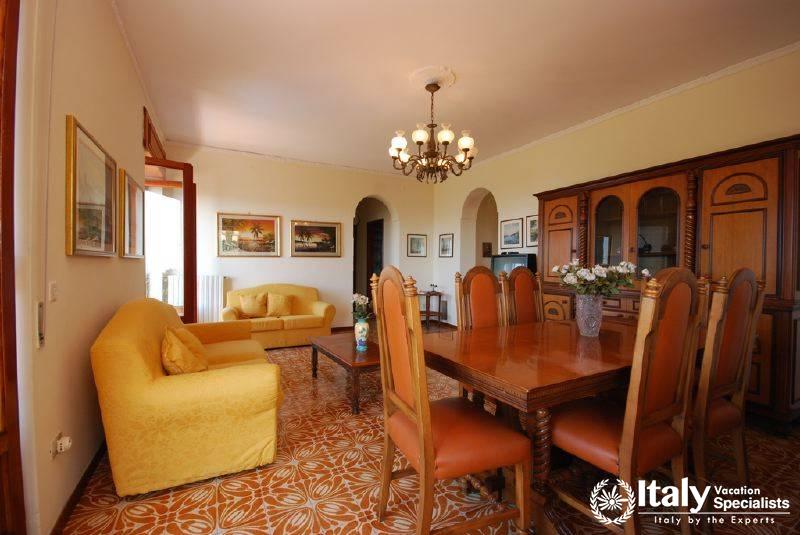 Sofas and dinning area in Villa Rocio