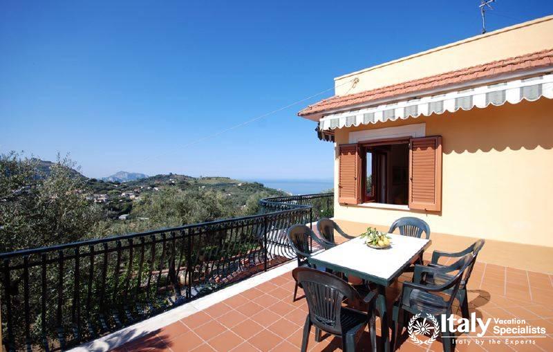 Sitting and dinning area in the terrace of Villa Rocio