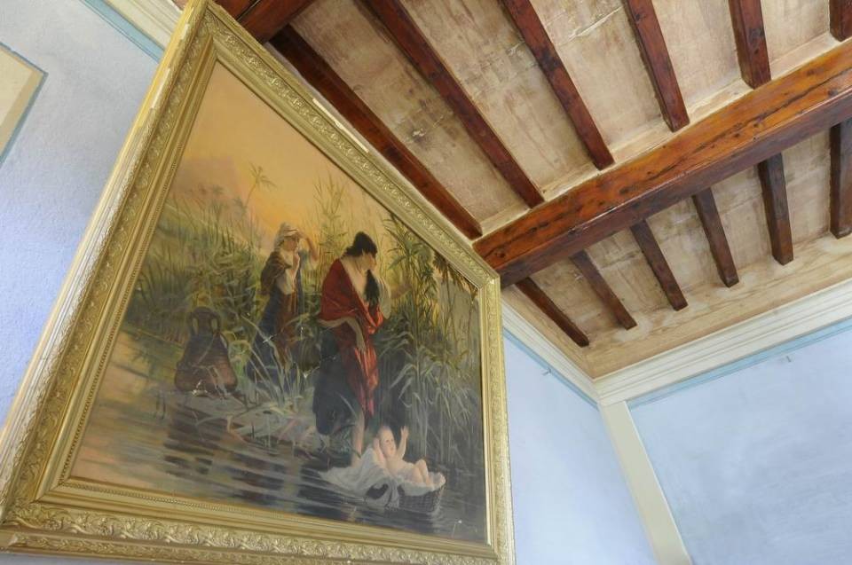 Painting and wood beam ceiling