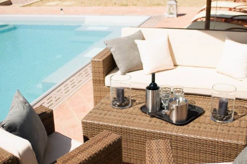 a glas of wine at the swimming pool