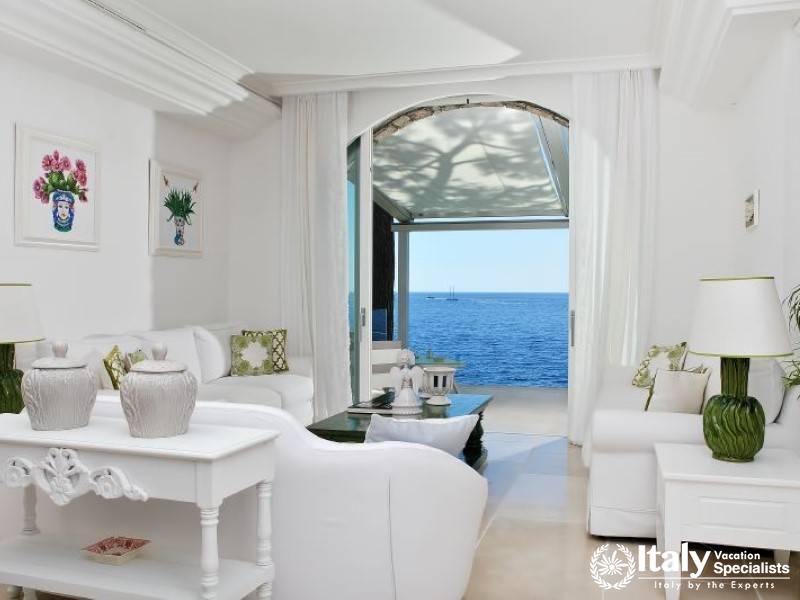 Bright living room with a direct ocean view.