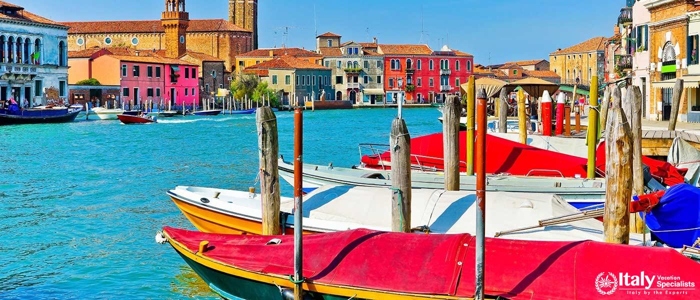 View of the colorful Venetian houses along the canal at the Islands of Murano in Venice