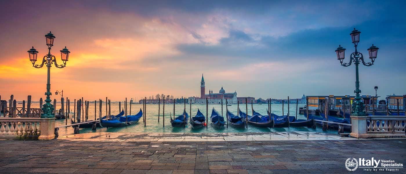 Panoramic cityscape image of Venice, Italy during sunrise