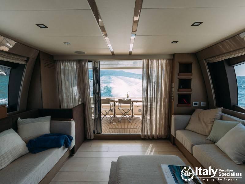 Interior of a luxurious yacht cabin with an open view to the sea.