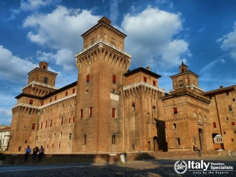 The formidable Ferrara Castle, surrounded by a moat, is a prominent symbol of the citys medieval po