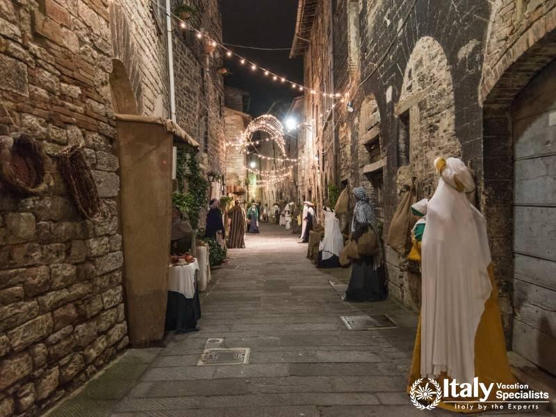 The charming medieval streets of Gubbio, beautifully lit and full of historical character.