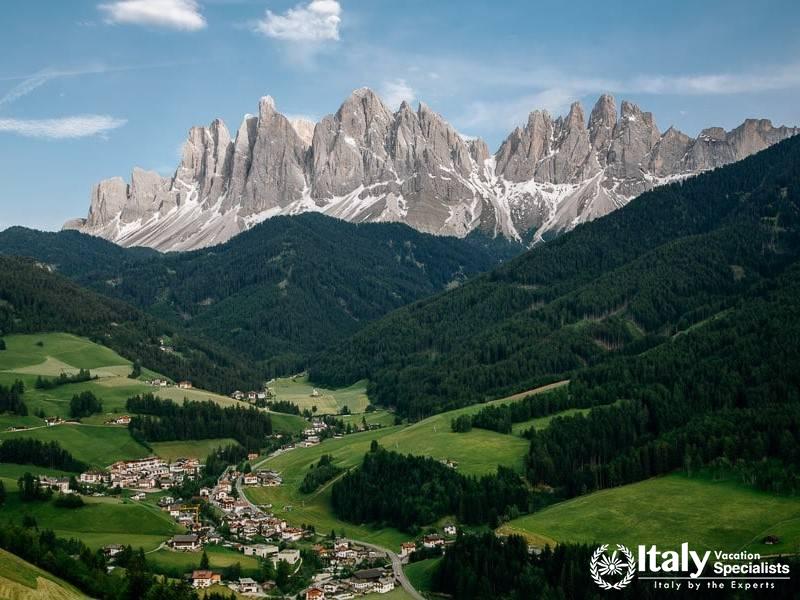 The lush Val di Funes valley, framed by the dramatic peaks of the Odle mountains