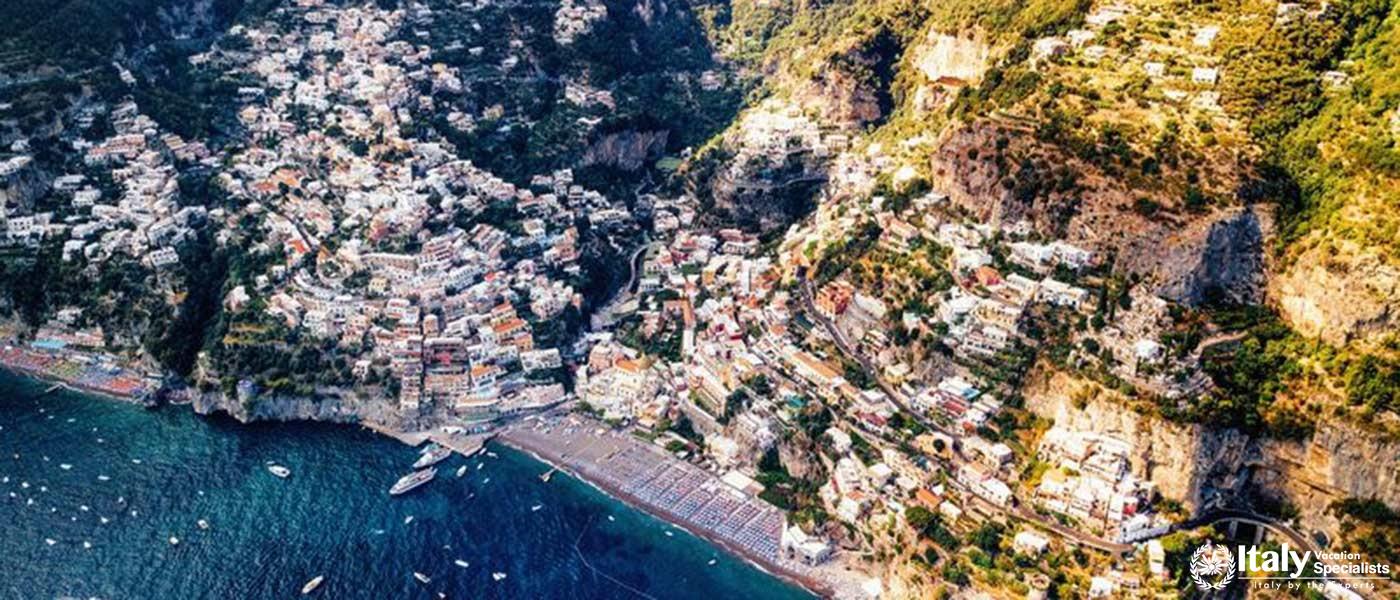 This image captures the stunning cliffside village of Positano, with its colorful buildings and scen