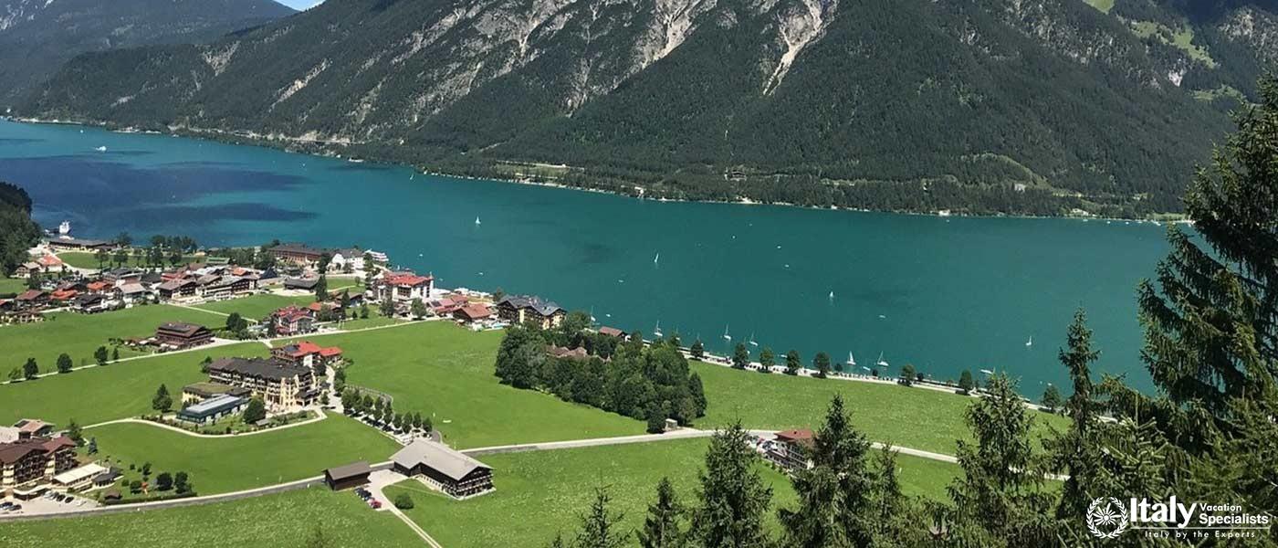 Lake Achensee with turquoise waters and a lakeside village.