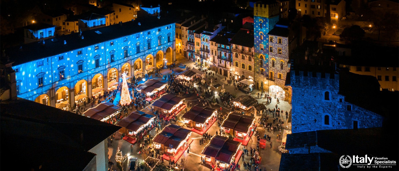 A Christmas market illuminated in the town of Arezzo, Tuscany