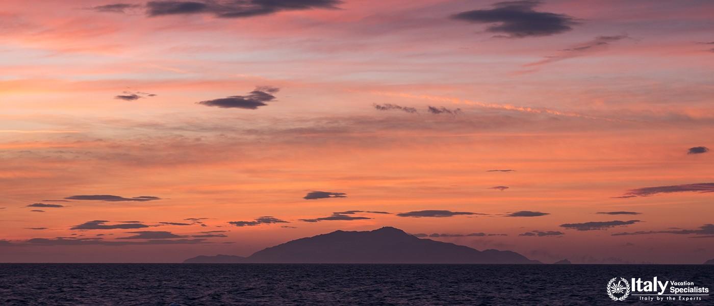 Sunset in the Bay of Naples, Italy. Mount Vesuvius can be seen on the horizon. Photographed near Sor