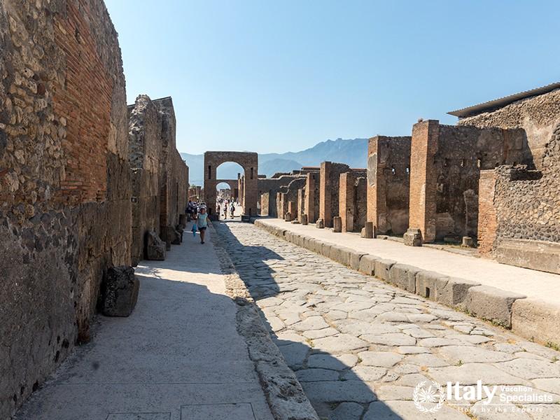 Pompeii, Italy - June 15, 2017 An ancient cobbled street in the ruins of Pompeii, Italy. Roman town 