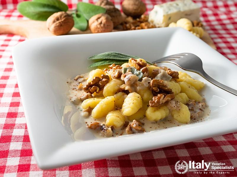 Dish of potato gnocchi with gorgonzola and walnuts, italian food