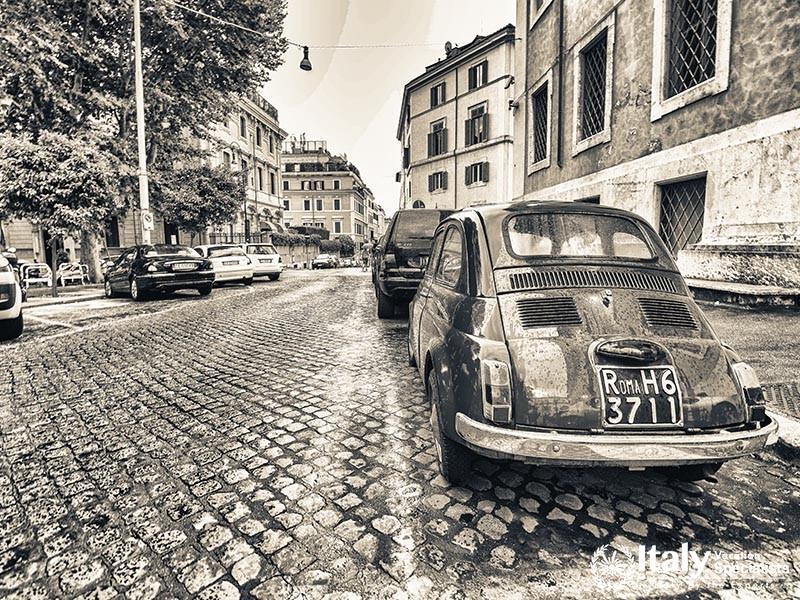 ROME - JUNE 14 Vintage red Fiat 500 parked in Via della Cosulta on June 14, 2014 in Rome, Italy. The