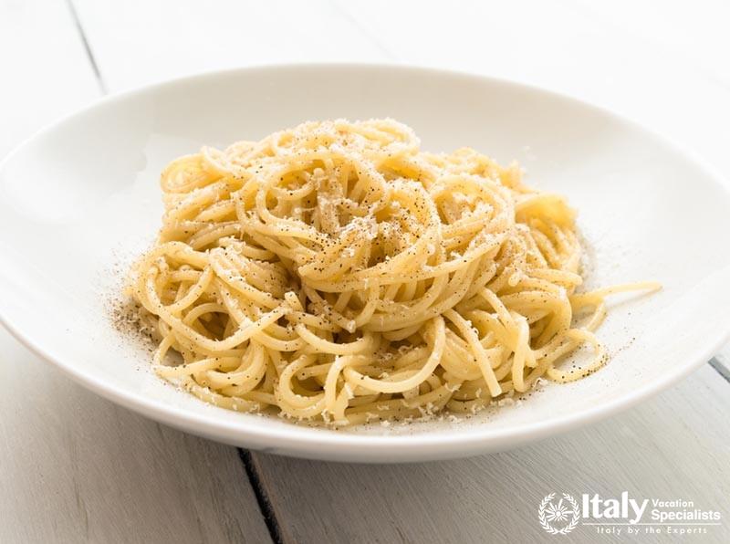 Pasta Cacio e Pepe, dish of italian spaghetti with pecorino cheese and black pepper, traditional rec
