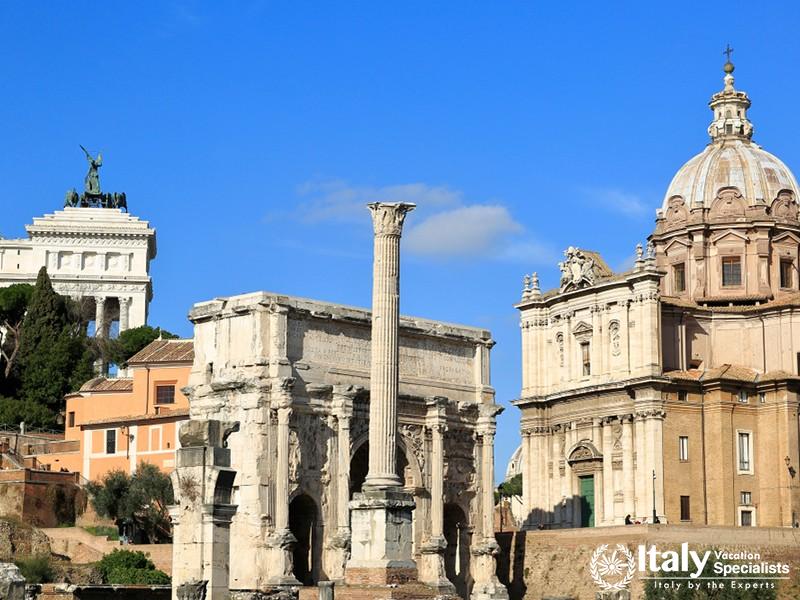 Ancient Roman ruins and distant church dome. Italy. A view from the Old Roman Forum.